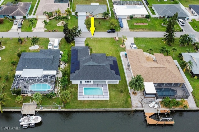 birds eye view of property featuring a water view