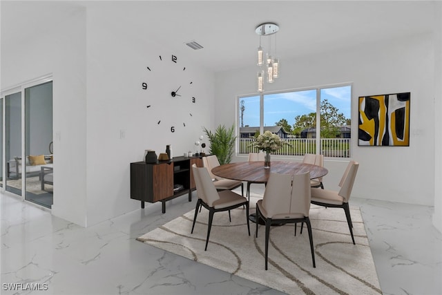 dining area with a notable chandelier