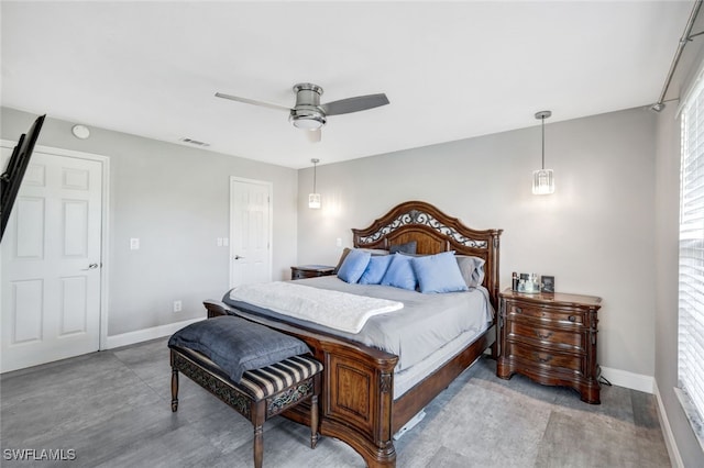 bedroom with multiple windows and ceiling fan