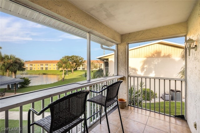 balcony with a water view and cooling unit