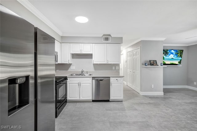 kitchen with white cabinets, appliances with stainless steel finishes, and ornamental molding