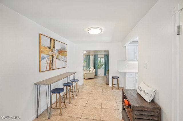 hallway with light tile patterned flooring