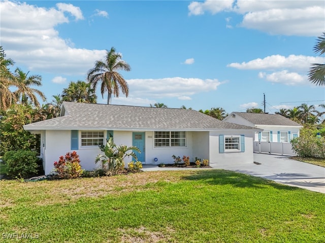 ranch-style house featuring a front lawn