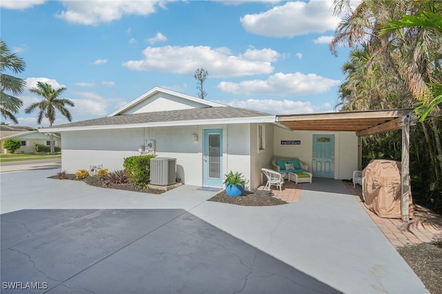 rear view of house featuring a carport