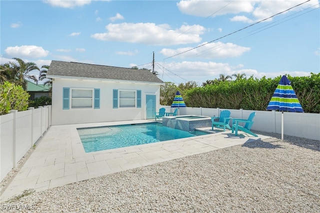 view of pool featuring a patio and an in ground hot tub