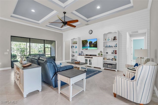 living room featuring ceiling fan, beam ceiling, ornamental molding, and coffered ceiling