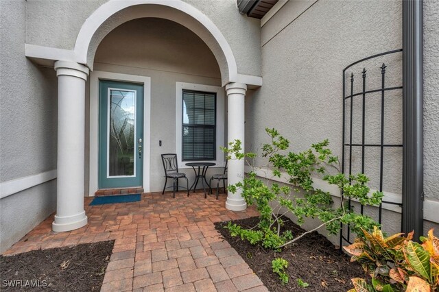 20533 Wilderness Ct, Estero, FL 33928 - entrance to property featuring stucco siding