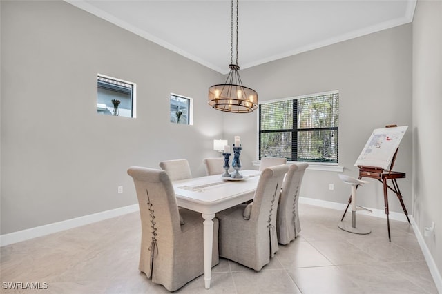 20533 Wilderness Ct, Estero, FL 33928 - dining space with crown molding, a chandelier, light tile patterned flooring, and baseboards