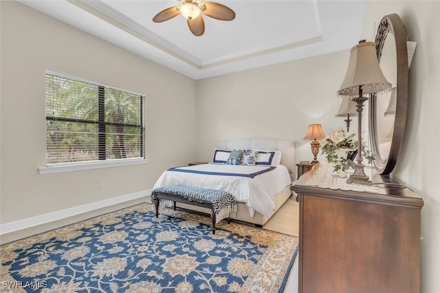 20533 Wilderness Ct, Estero, FL 33928 - bedroom featuring baseboards, a tray ceiling, and ceiling fan