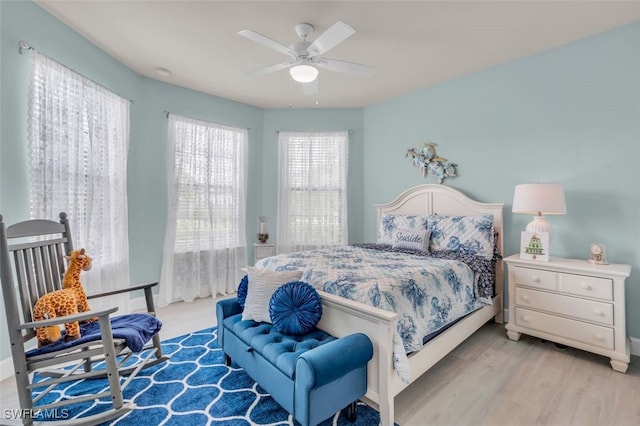 bedroom featuring ceiling fan and light hardwood / wood-style floors