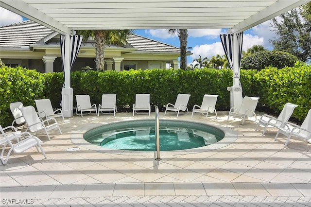 view of pool featuring a community hot tub, a pergola, and a patio