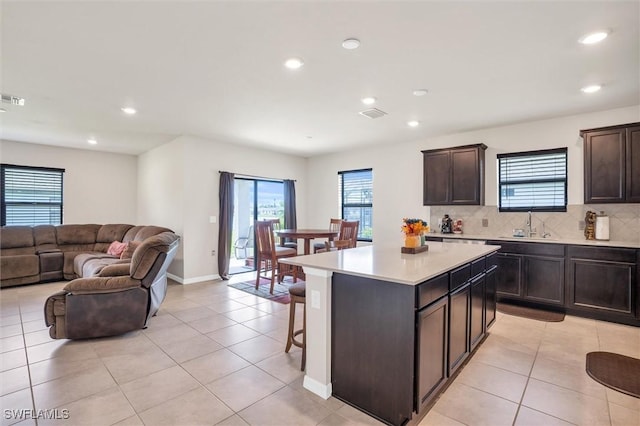 10852 Marlberry Way N, Fort Myers, FL 33917 - kitchen with light tile patterned flooring, light countertops, open floor plan, healthy amount of natural light, and recessed lighting