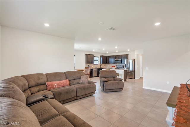 living room featuring light tile patterned floors