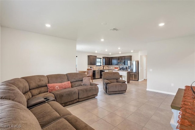 10852 Marlberry Way N, Fort Myers, FL 33917 - living room featuring recessed lighting, light tile patterned flooring, and baseboards