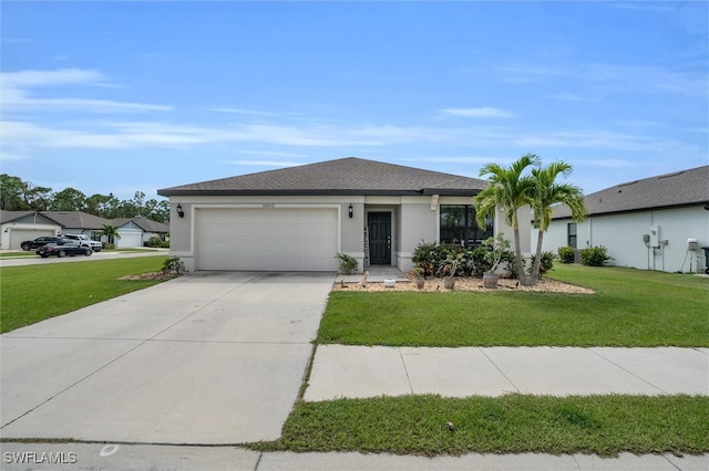 view of front of house with a garage and a front lawn