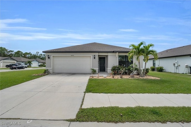 10852 Marlberry Way N, Fort Myers, FL 33917 - view of front of property featuring an attached garage, driveway, a front lawn, and stucco siding