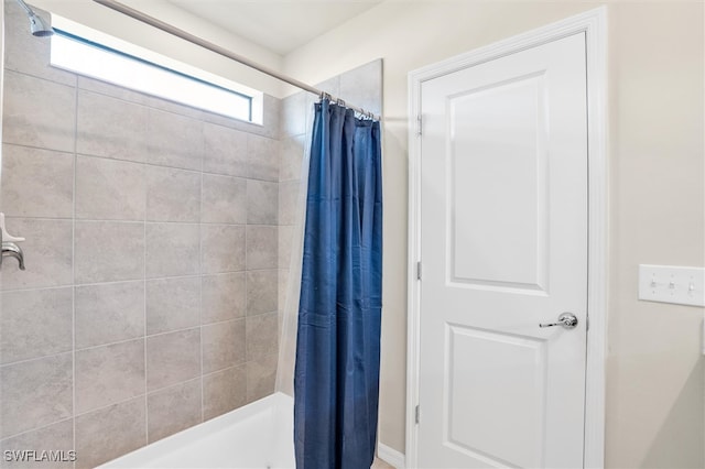 bathroom with curtained shower