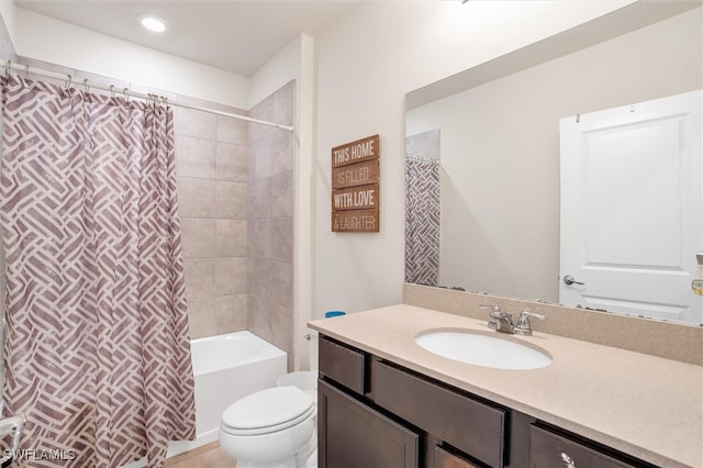 full bathroom with vanity, shower / bath combination with curtain, and toilet