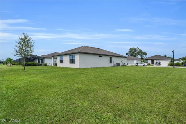 view of side of home featuring a lawn