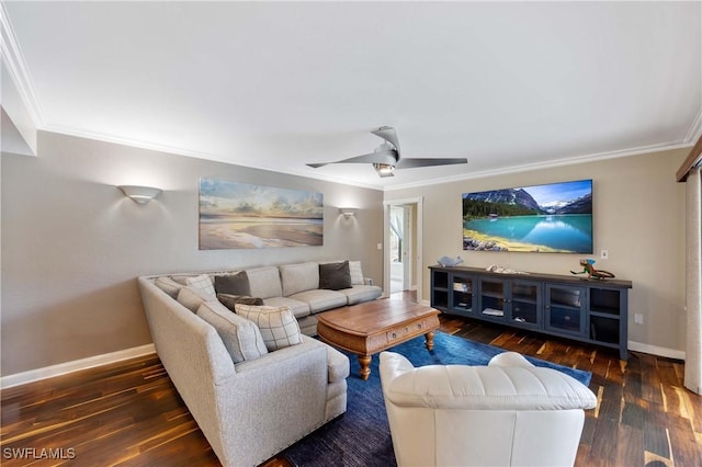 living room featuring ornamental molding, ceiling fan, baseboards, and wood finished floors