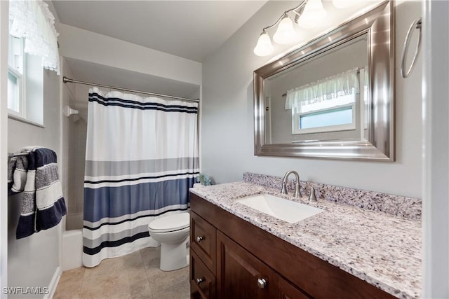 bathroom with tile patterned floors, vanity, and toilet