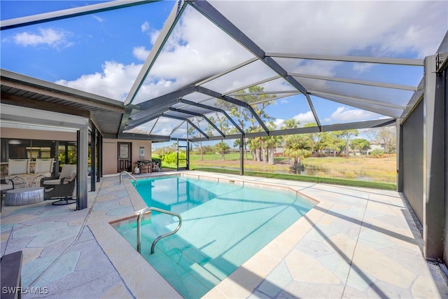 view of pool featuring outdoor lounge area, a lanai, and a patio