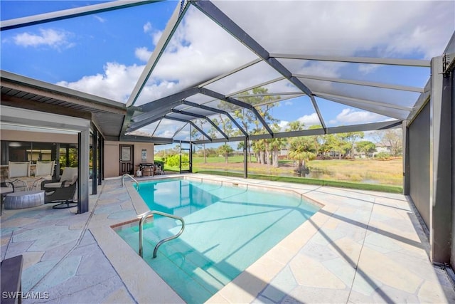 outdoor pool with a patio area and a lanai