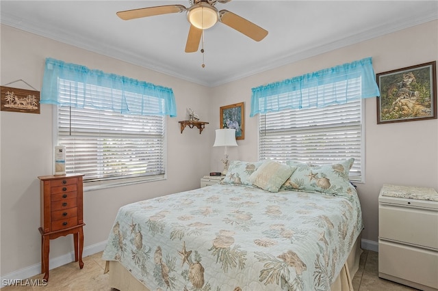 tiled bedroom with ornamental molding and ceiling fan