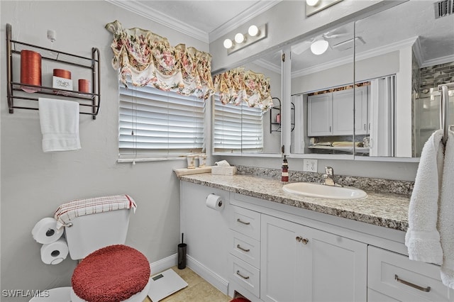 bathroom with crown molding, vanity, tile patterned flooring, and walk in shower