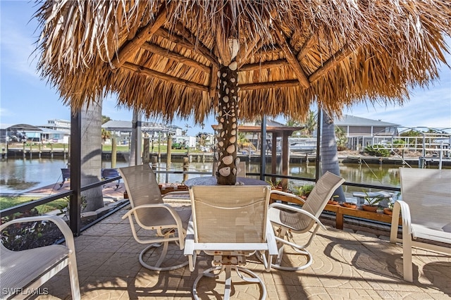 dock area with a gazebo and a water view