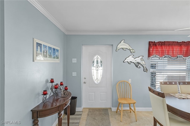 entrance foyer with crown molding and light tile patterned floors