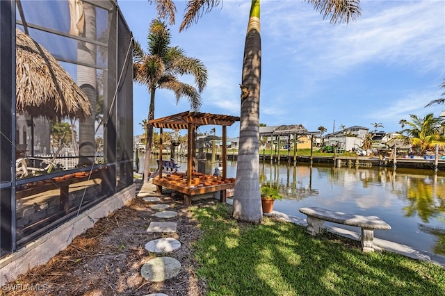 view of dock featuring glass enclosure and a water view