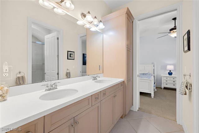 bathroom with vanity, tile patterned floors, ceiling fan, and a shower with shower door