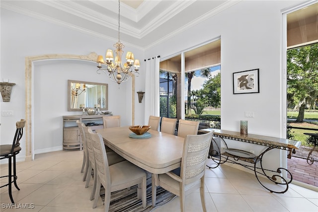 tiled dining room featuring ornamental molding and a notable chandelier