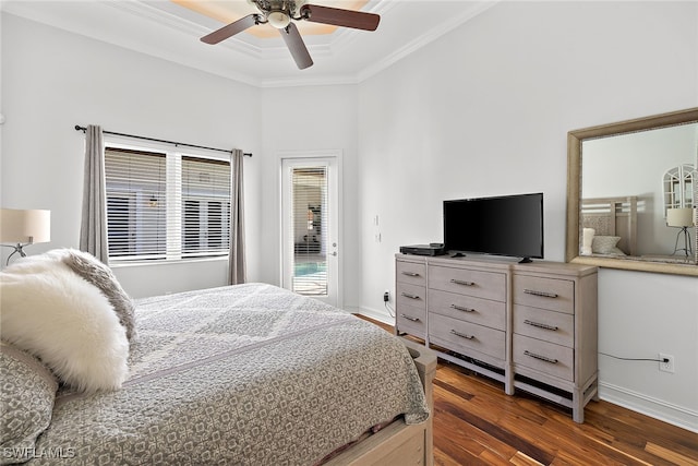 bedroom with ornamental molding, a towering ceiling, dark wood-type flooring, a tray ceiling, and ceiling fan