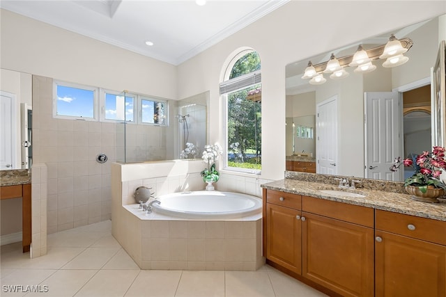 bathroom with vanity, tile patterned floors, shower with separate bathtub, and ornamental molding