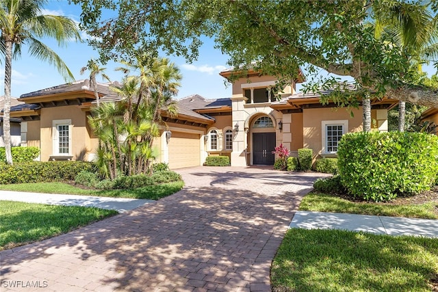 mediterranean / spanish house featuring a garage