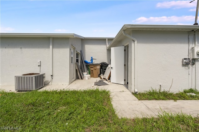 view of side of home with cooling unit