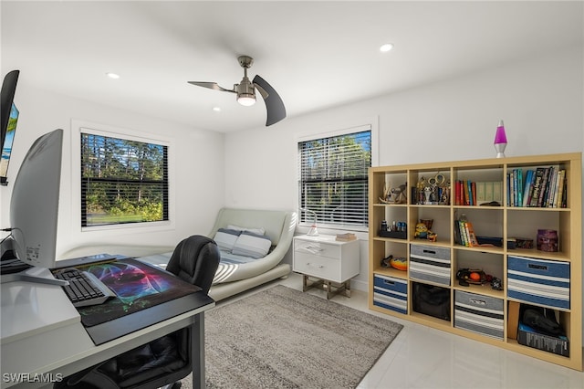 tiled office featuring ceiling fan