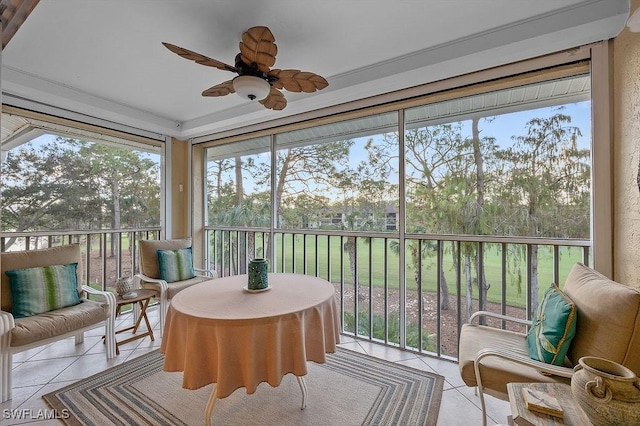 sunroom with a ceiling fan