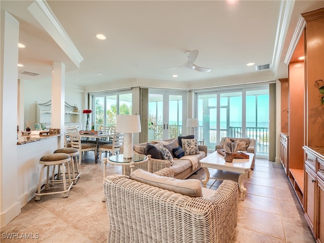 living room featuring ceiling fan and ornamental molding