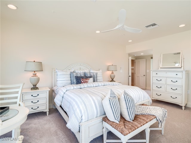 bedroom featuring ceiling fan and carpet