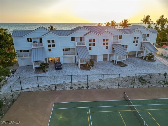 aerial view at dusk with a water view