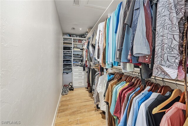 spacious closet featuring light hardwood / wood-style flooring