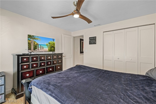 bedroom with ceiling fan and a closet