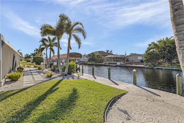 exterior space with a lawn and a water view