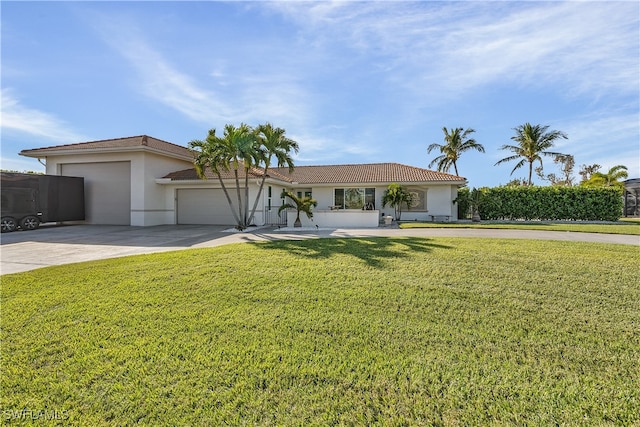 single story home with a front yard and a garage