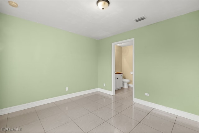 empty room featuring light tile patterned floors