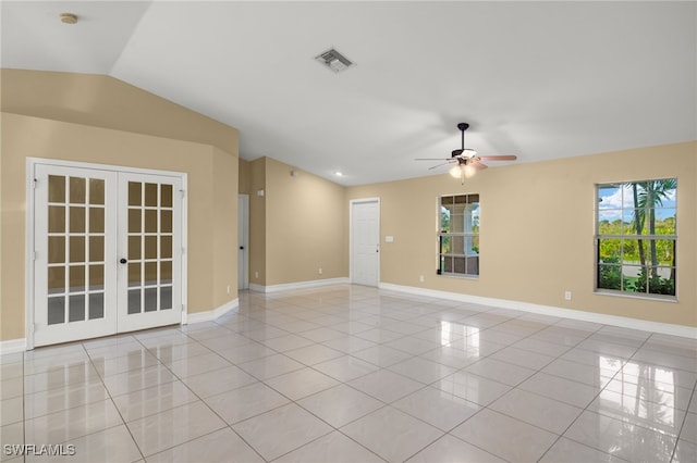 unfurnished room with light tile patterned floors, vaulted ceiling, french doors, and ceiling fan