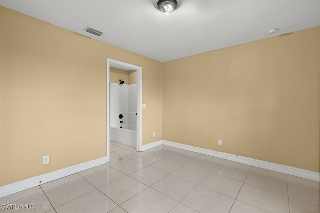 empty room featuring light tile patterned floors